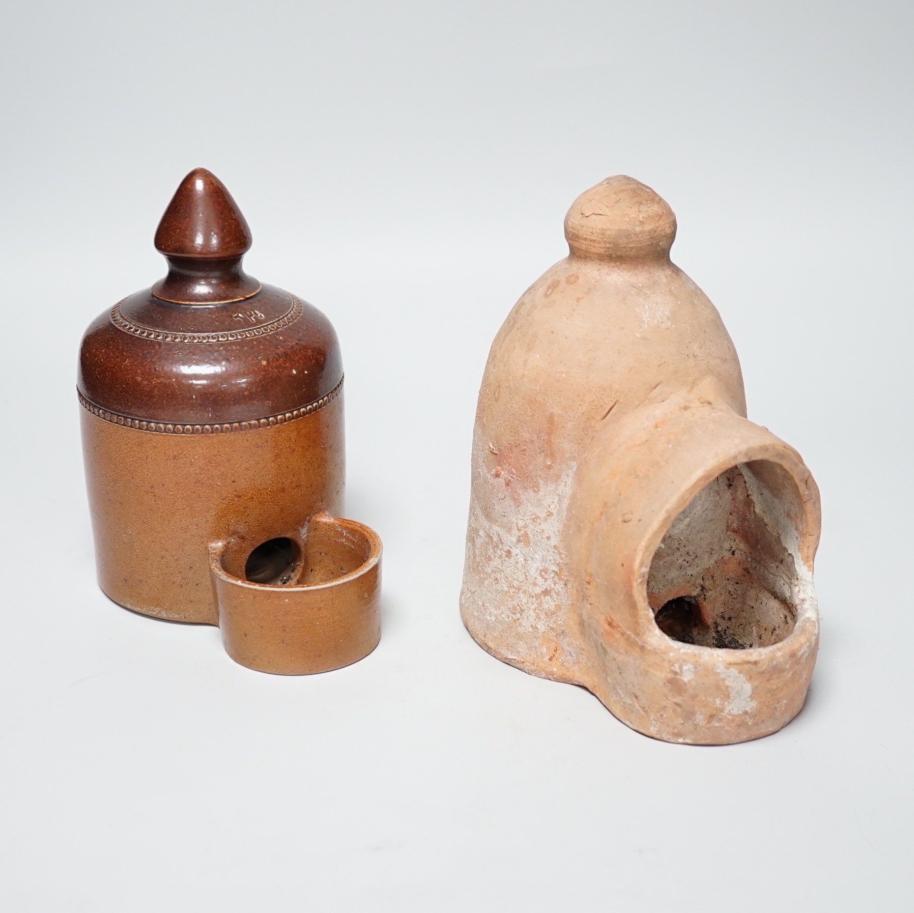 A late 18th / early 19th century Sussex pottery bird feeder and a Denby example, the largest 17cm high